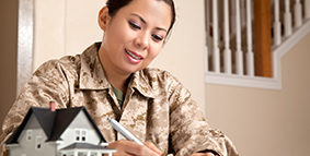 A female soldier, looking at her financials