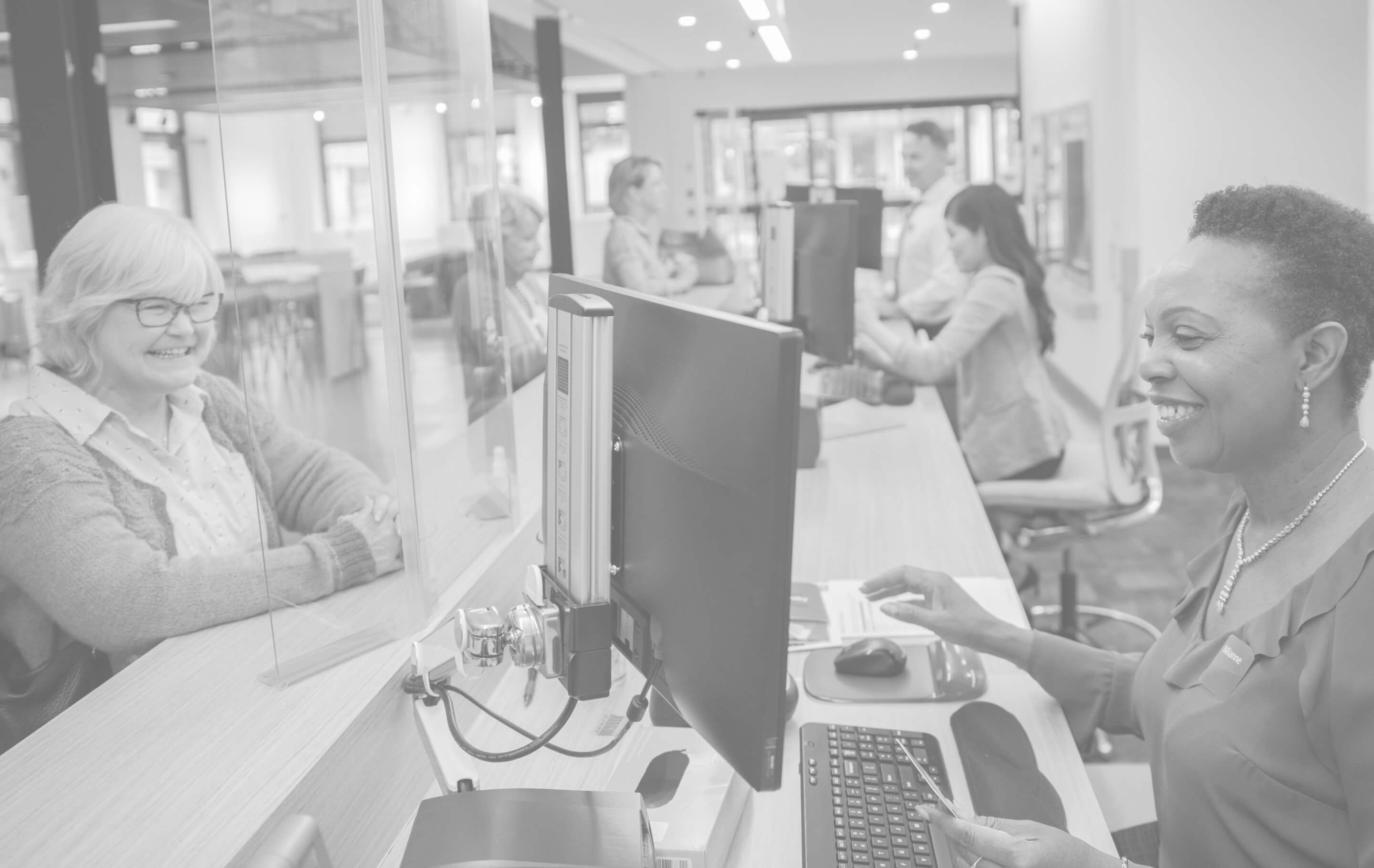 Customers and teller in a bank