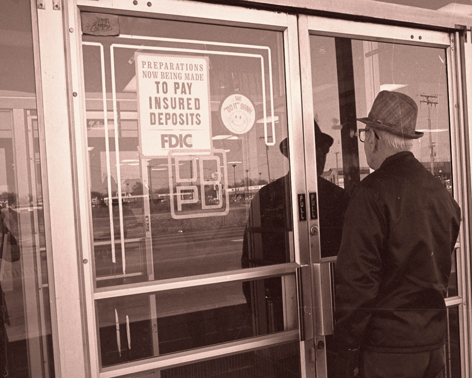 Man standing in front of closed bank