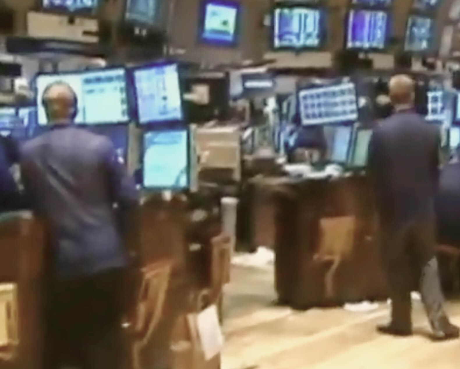 People working on the floor of the stock exchange