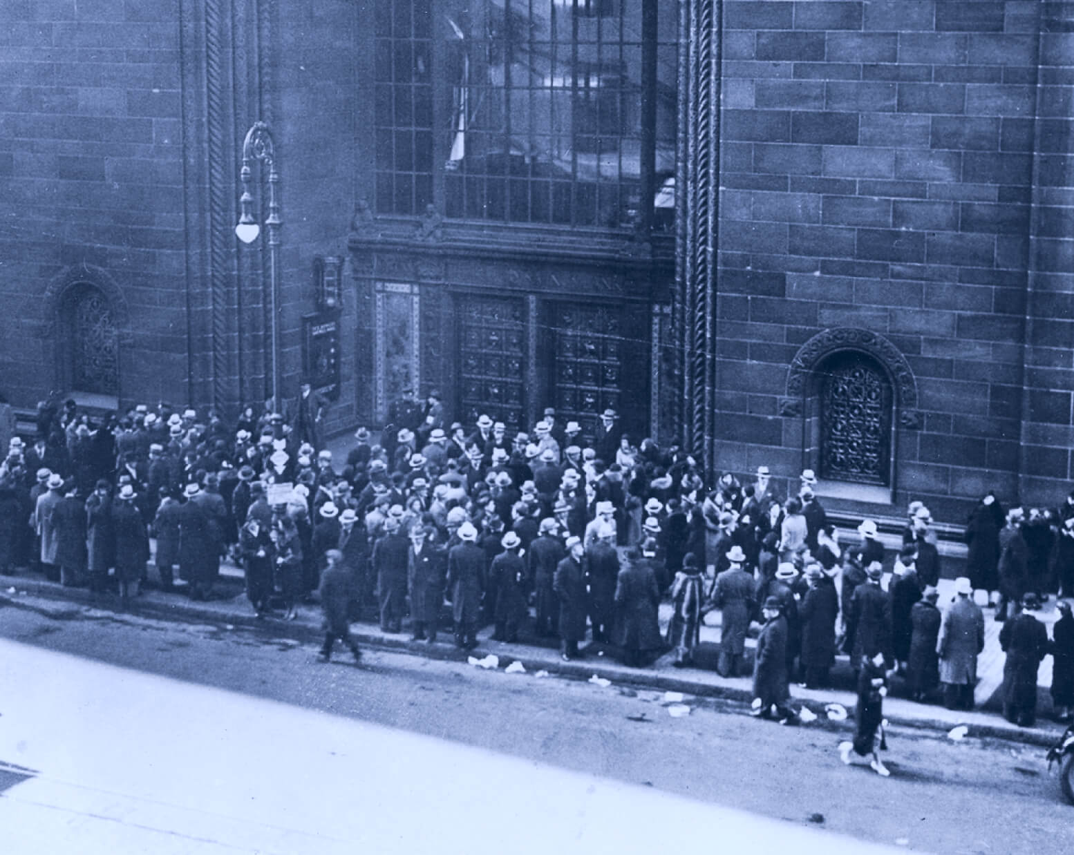 People waiting in line to enter the bank