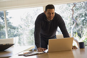 man looking at laptop